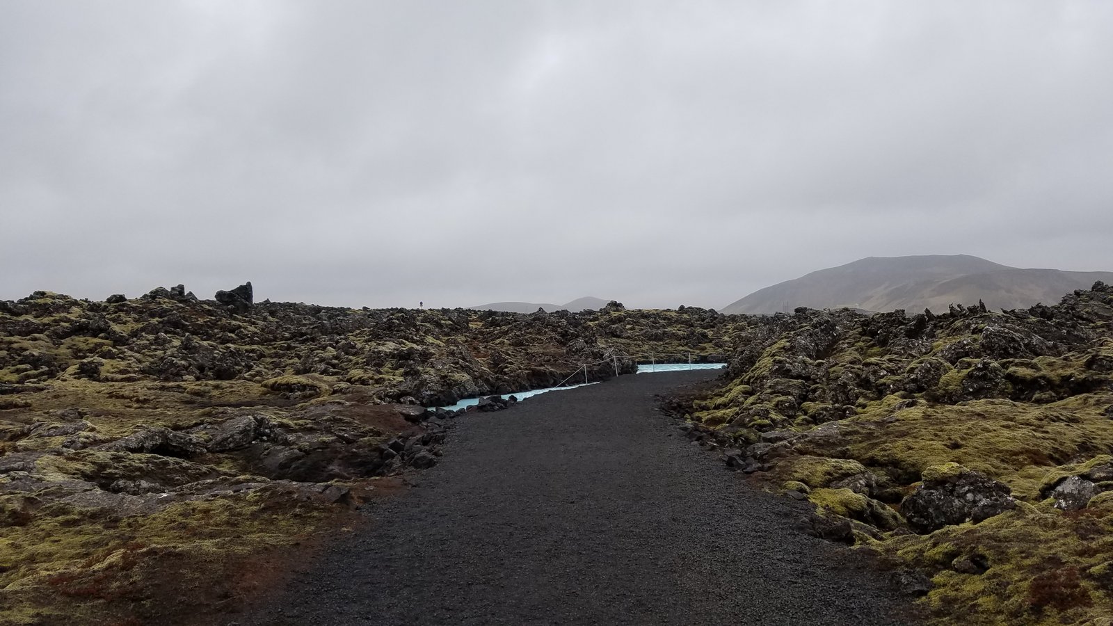 A path leads through the lava fields off to the Blue Lagoon geothermal spa.